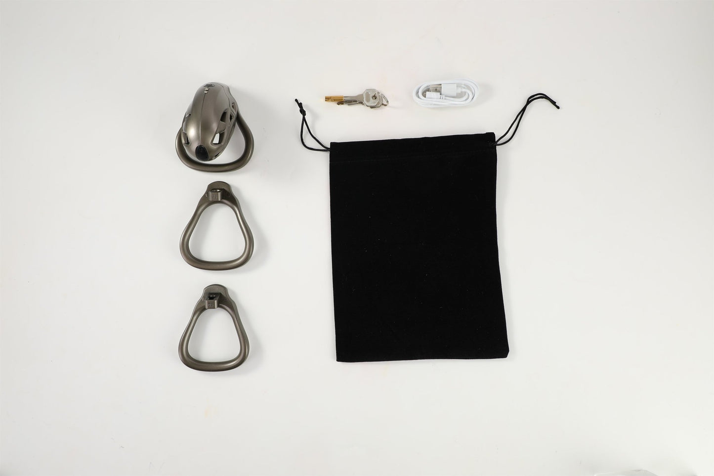 Display of all accessories for the bronze metal male chastity cage