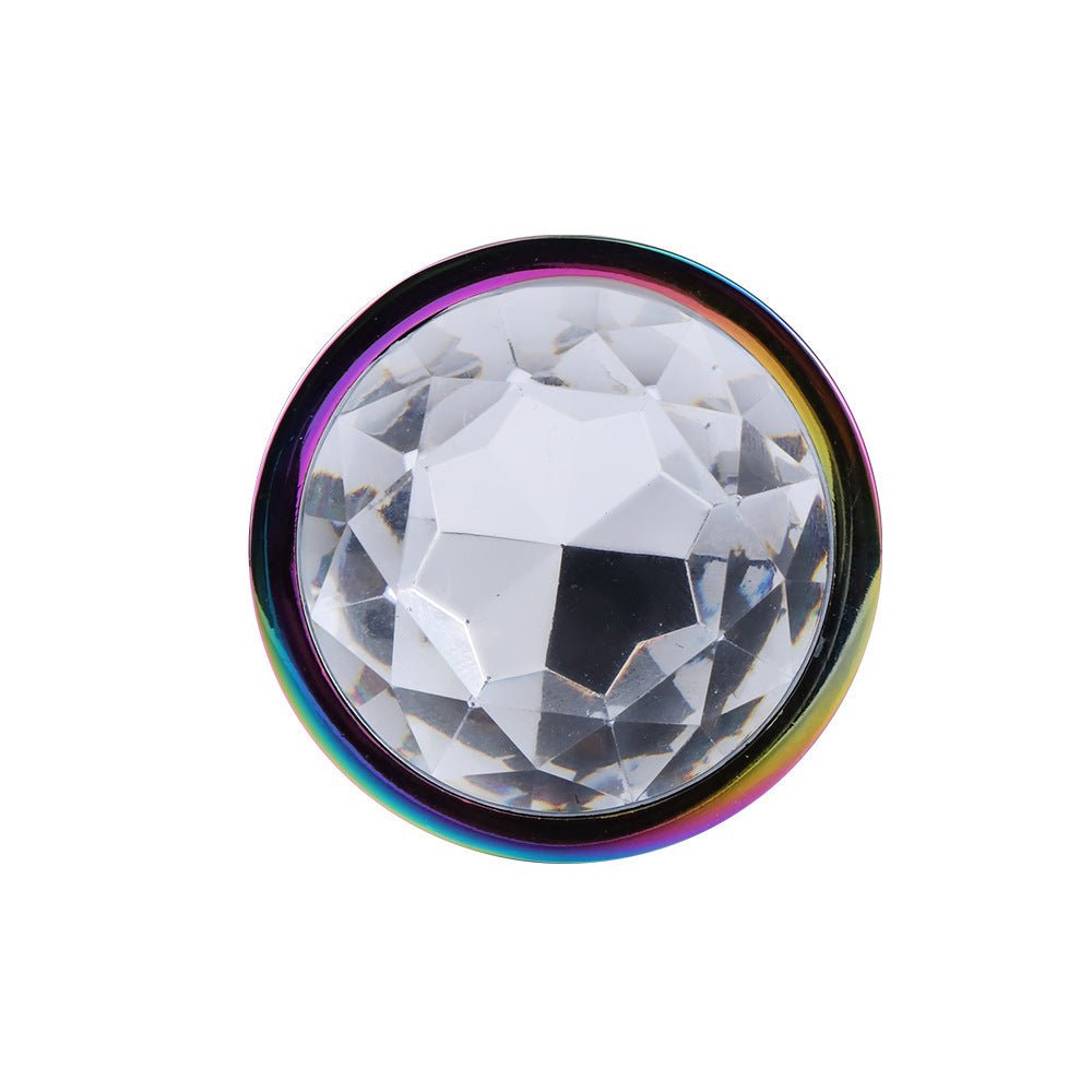 Close-up of the rainbow gemstone base metal butt plug gemstone base
