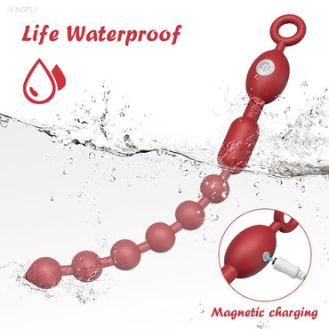 The red beaded electric butt plug with safety pull ring features a waterproof design